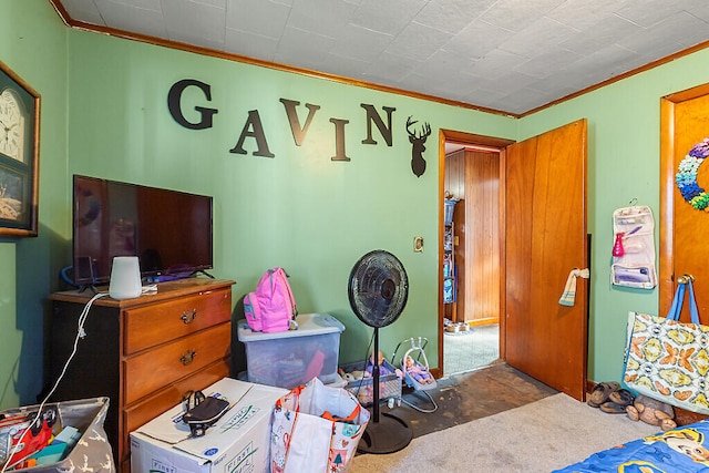 carpeted bedroom featuring ornamental molding