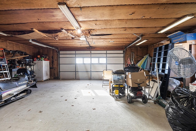 garage with white fridge