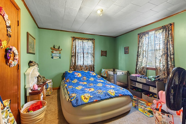 bedroom featuring carpet floors and ornamental molding