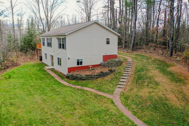 view of side of property with a lawn