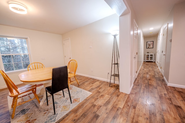 dining area with hardwood / wood-style flooring