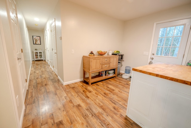 corridor featuring light hardwood / wood-style floors