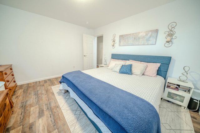 bedroom featuring hardwood / wood-style floors