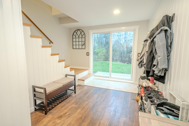 doorway to outside with wood-type flooring