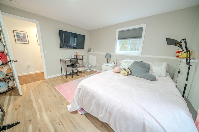 bedroom with light wood-type flooring