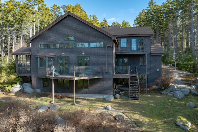 1700 Tremont Rd, Tremont, ME 04674 - back of property with a sunroom, stairs, and a yard