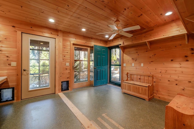 doorway featuring wooden walls, plenty of natural light, and wooden ceiling