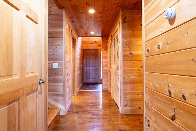 1700 Tremont Rd, Tremont, ME 04674 - corridor with wood-type flooring, wooden walls, recessed lighting, and wooden ceiling