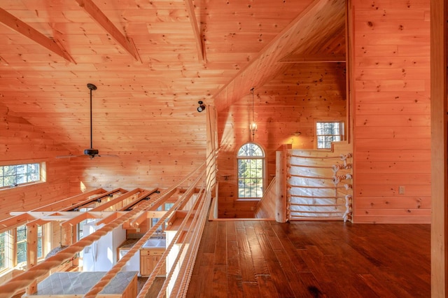1700 Tremont Rd, Tremont, ME 04674 - hallway with wood walls, a wood ceiling with exposed beams, plenty of natural light, dark wood-style flooring, and an upstairs landing