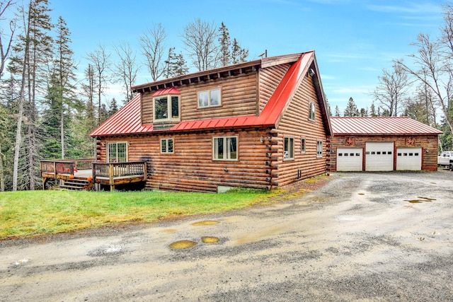 658 Mingo Loop Rd, Rangeley, ME 04970 - view of side of property featuring log siding, a deck, metal roof, a garage, and a yard