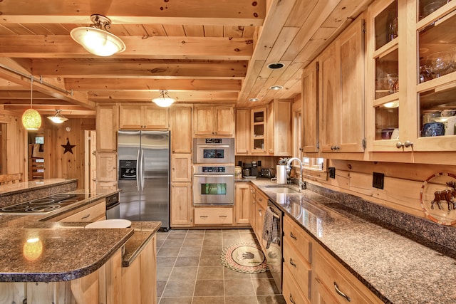 kitchen featuring dark stone counters, wood ceiling, stainless steel appliances, beam ceiling, and pendant lighting