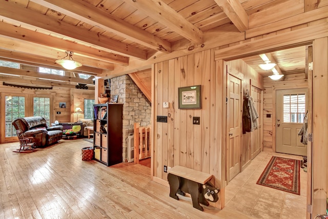 658 Mingo Loop Rd, Rangeley, ME 04970 - hall featuring wooden walls, wood ceiling with exposed beams, and light wood-type flooring