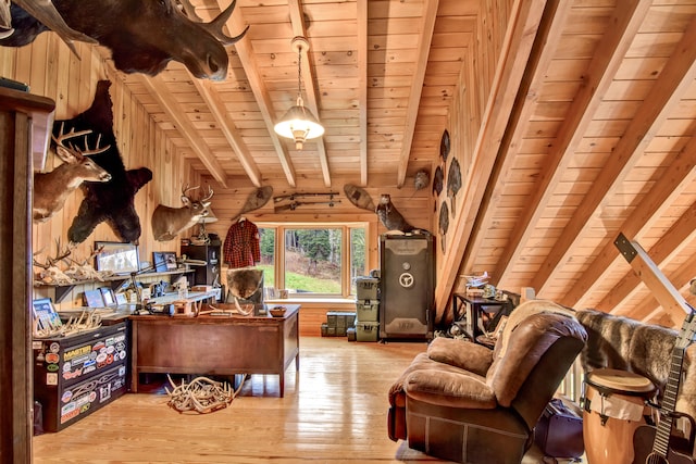 office space featuring beamed ceiling, wood walls, light hardwood / wood-style floors, and wood ceiling