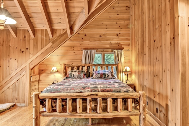 bedroom featuring hardwood / wood-style floors, wood ceiling, and wood walls