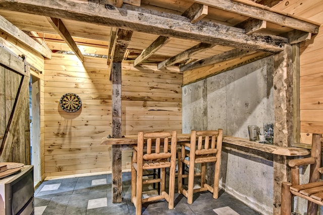 unfurnished dining area with a barn door