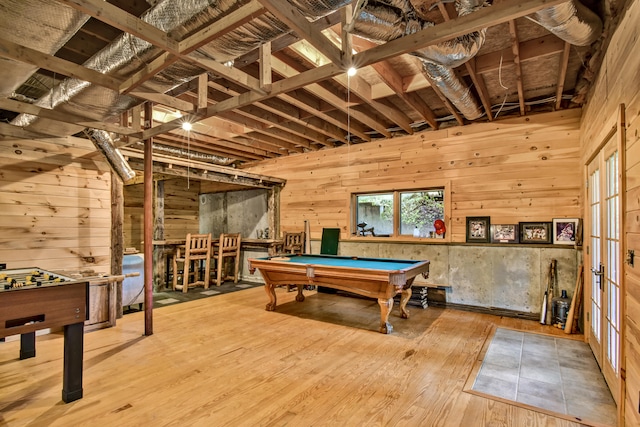 recreation room with wooden walls, wood-type flooring, and pool table