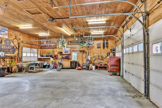 garage with a workshop area and wooden ceiling