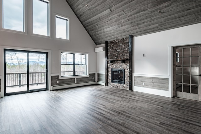 unfurnished living room featuring a stone fireplace, a baseboard radiator, high vaulted ceiling, and wood-type flooring