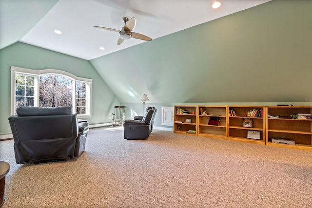 interior space with carpet, ceiling fan, lofted ceiling, and baseboard heating