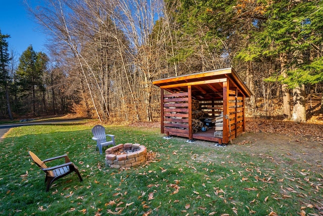 view of yard with an outdoor fire pit