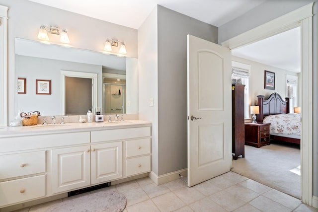 bathroom with tile patterned floors, vanity, and a shower with shower door