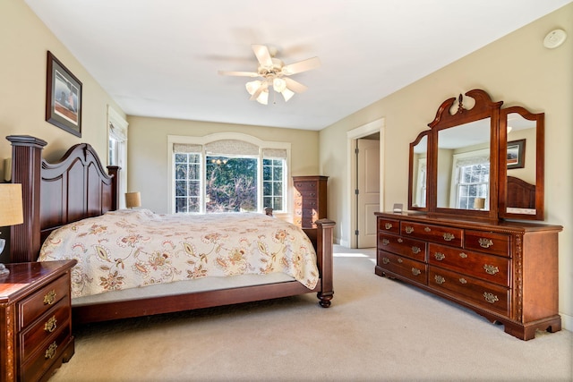 bedroom featuring ceiling fan and light colored carpet