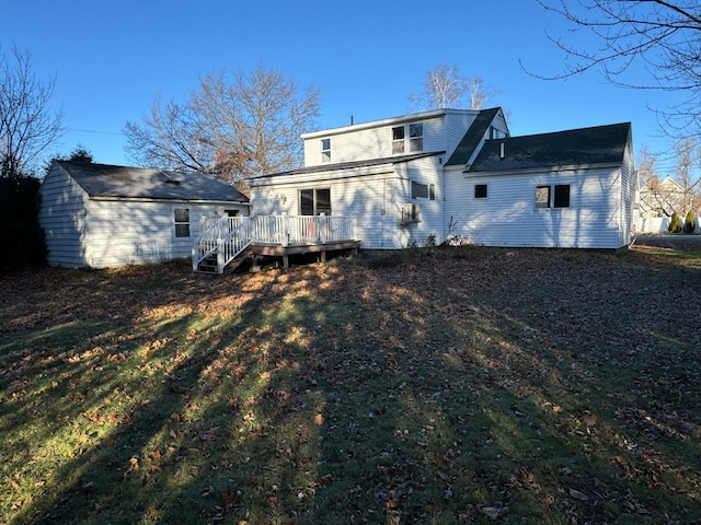 back of house featuring a yard and a wooden deck