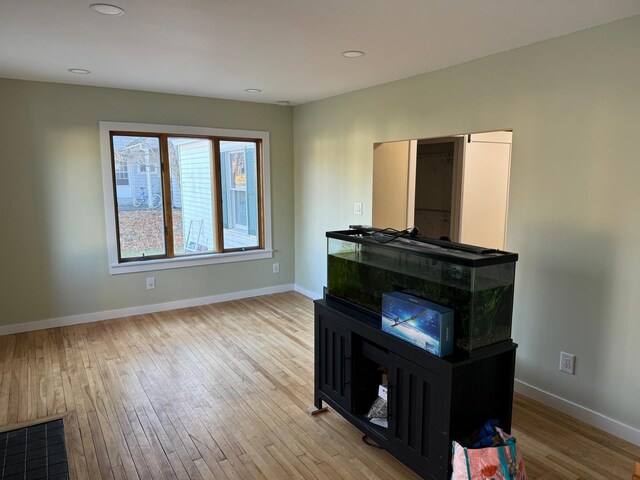 unfurnished living room with light hardwood / wood-style flooring