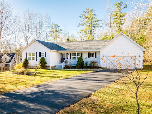 view of front facade with a front lawn and a garage