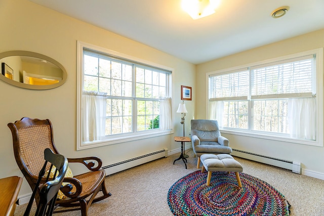 sitting room with carpet floors and baseboard heating