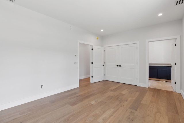 43 Rose Douglas Ln, Brunswick, ME 04011 - unfurnished bedroom with light wood-style floors, a closet, visible vents, recessed lighting, and baseboards