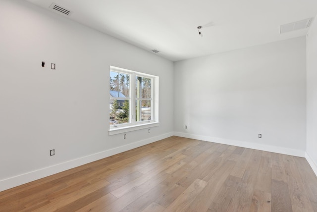 43 Rose Douglas Ln, Brunswick, ME 04011 - empty room with light wood-style floors, visible vents, and baseboards