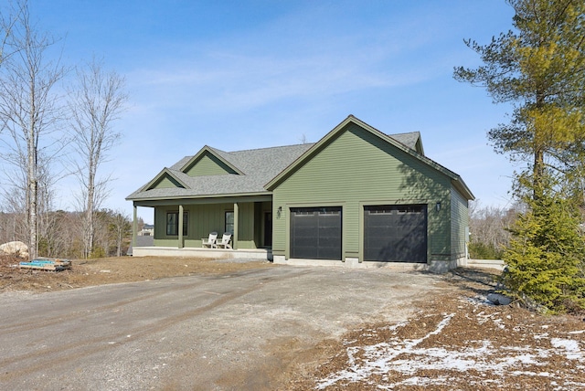 43 Rose Douglas Ln, Brunswick, ME 04011 - view of front of house featuring a garage, covered porch, and driveway