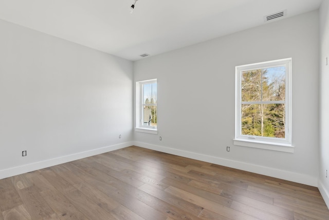 43 Rose Douglas Ln, Brunswick, ME 04011 - unfurnished room featuring baseboards, visible vents, and hardwood / wood-style flooring