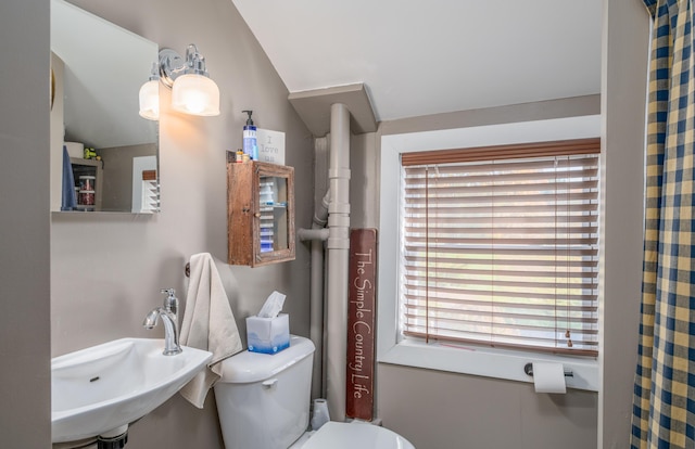 27 Mace Ave, Winthrop, ME 04364 - bathroom with a sink, toilet, and lofted ceiling