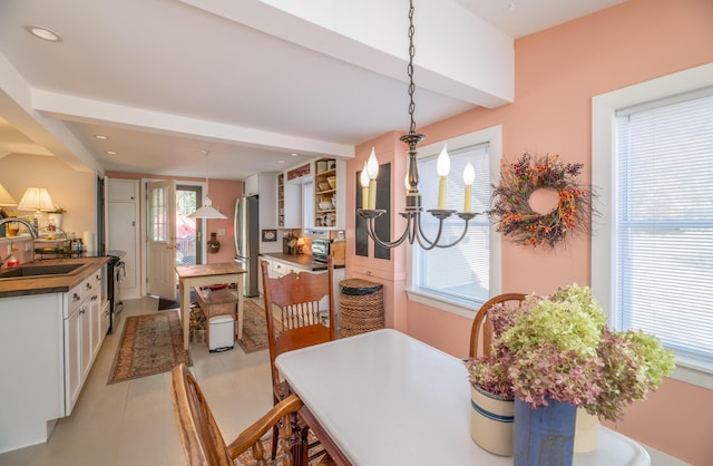 27 Mace Ave, Winthrop, ME 04364 - dining area with beam ceiling, a chandelier, and recessed lighting