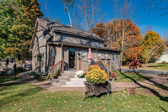 27 Mace Ave, Winthrop, ME 04364 - rear view of house with a yard