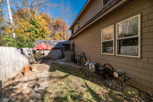 27 Mace Ave, Winthrop, ME 04364 - view of home's exterior with fence