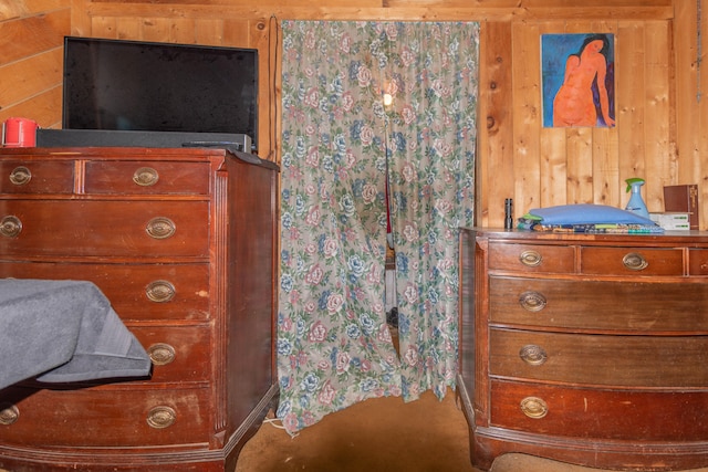 bedroom with wood walls