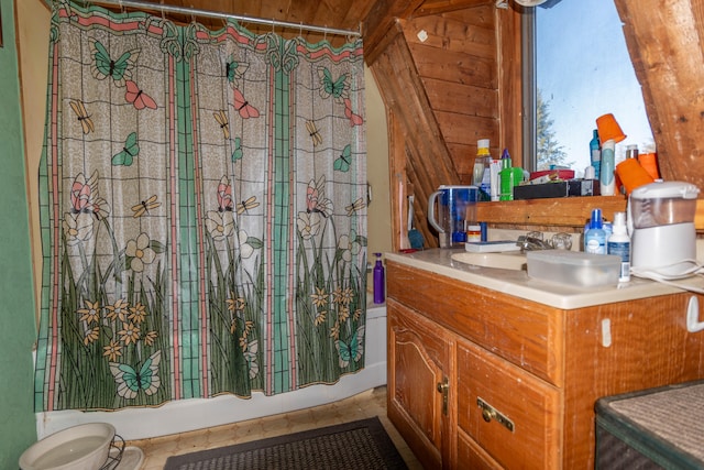 bathroom with shower / bath combo, tile patterned flooring, wooden walls, vanity, and wood ceiling