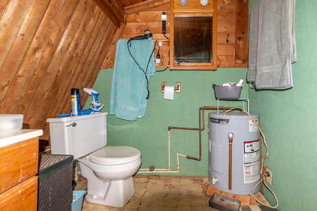 bathroom with vanity, wood walls, toilet, and water heater