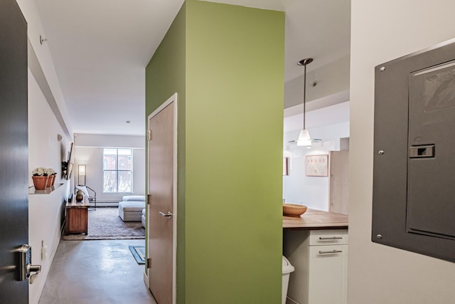 21 Chestnut St Unit 304, Portland, ME 04101 - hallway featuring concrete floors, electric panel, and a baseboard radiator