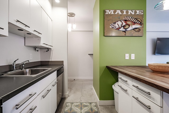 21 Chestnut St Unit 304, Portland, ME 04101 - kitchen featuring wood counters, a sink, white cabinetry, baseboards, and dishwasher