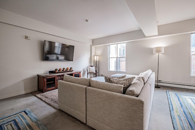 living room featuring baseboard heating and concrete floors