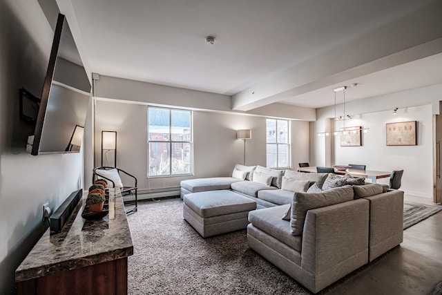 living room featuring concrete flooring and a baseboard heating unit