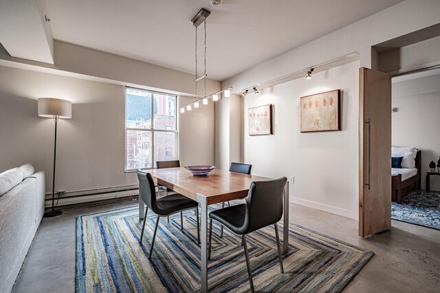 21 Chestnut St Unit 304, Portland, ME 04101 - dining room featuring concrete floors, baseboard heating, and baseboards
