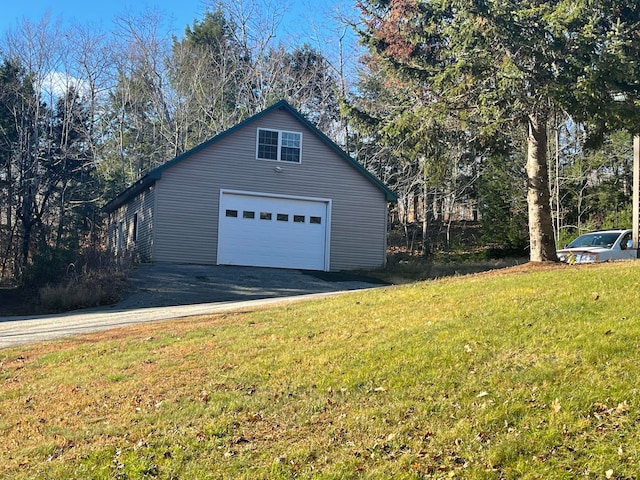 garage featuring a yard