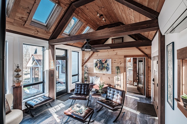 sunroom / solarium with ceiling fan, wooden ceiling, and vaulted ceiling with skylight