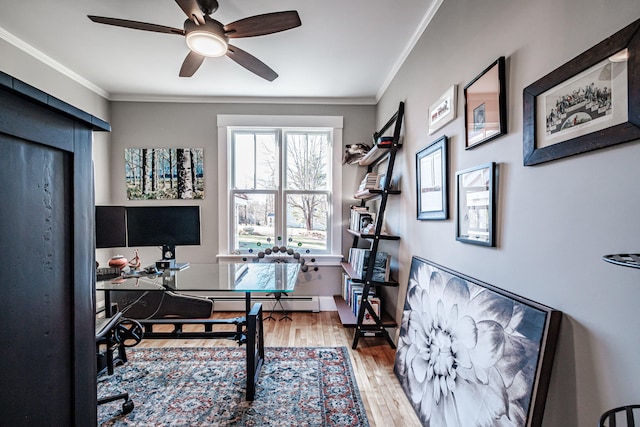 office area featuring hardwood / wood-style floors, a baseboard radiator, ceiling fan, and crown molding