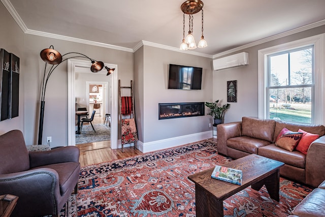 living room with hardwood / wood-style floors, an AC wall unit, ornamental molding, and an inviting chandelier